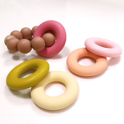 Vòng hạt silicone hình bánh rán buộc dây SGS 4.2 * 4.2 * 0.9cm cho bé